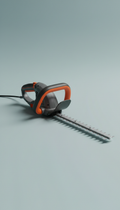 Electric hedge trimmer with impact-resistant body